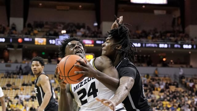 Missouri Tigers guard Kobe Brown (24) controls the ball as he is fouled by Mississippi State Bulldogs forward Tyler Stevenson (14) during the first half at Mizzou Arena.